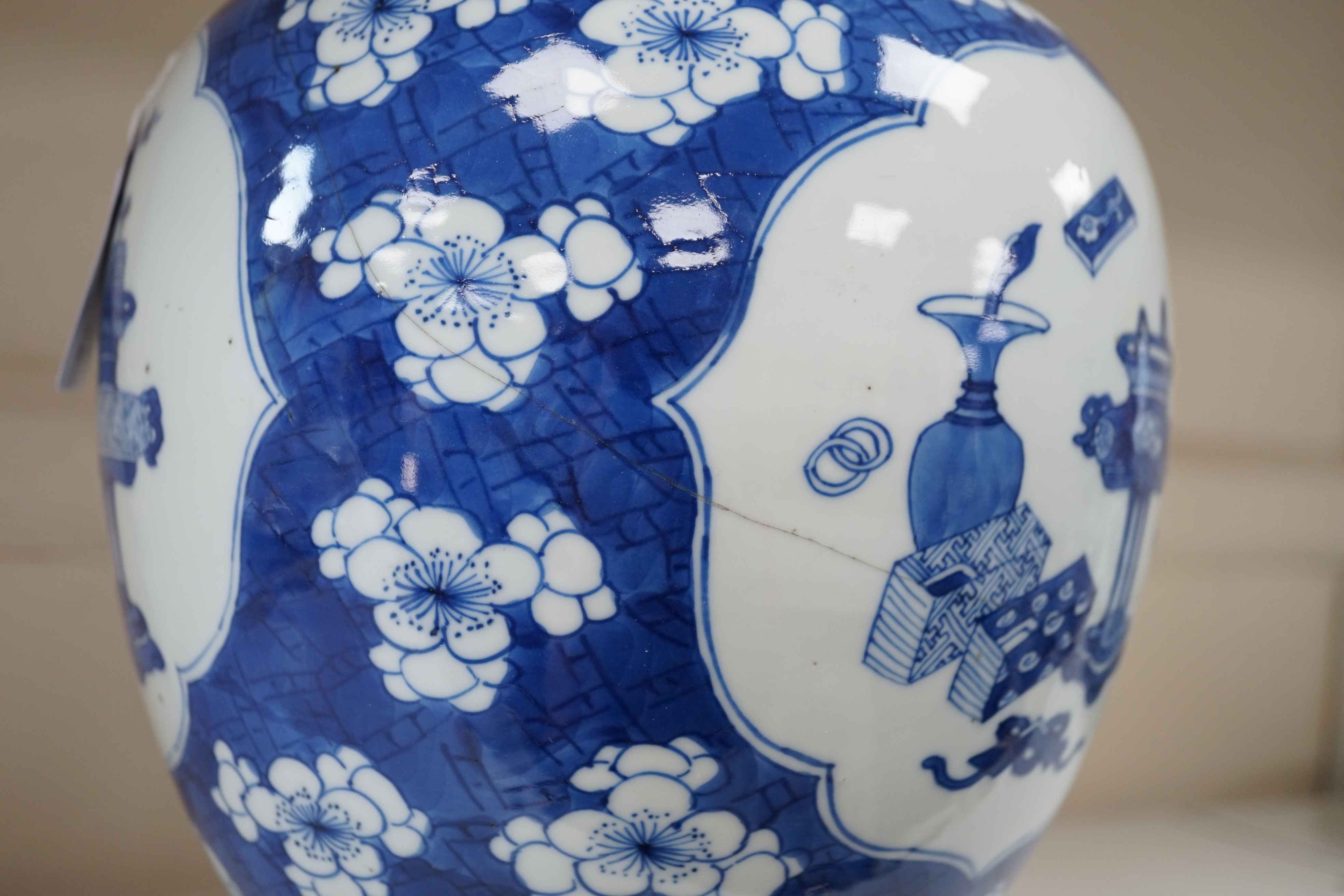 A Chinese blue and white ‘Antiques’ jar, Kangxi period, cracked